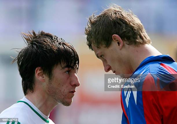 Tomas Necid of PFC CSKA Moscow conflicts with Rizvan Utsiyev of FC Terek Grozny during the Russian Football League Championship match between PFC...