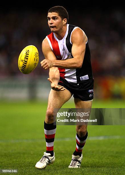 Leigh Montagna of the Saints handballs during the round seven AFL match between the St Kilda Saints and the Carlton Blues at Etihad Stadium on May...