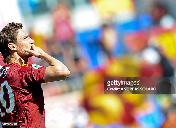 Roma's forward Francesco Totti celebrates after scoring against Cagliari during their Italian Serie A football match on May 9, 2010 at Rome's Olympic...