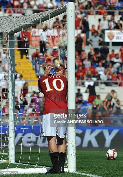 Roma's forward Francesco Totti reacts as missing a goal opportunity against Cagliari during their Italian Serie A football match on May 9, 2010 at...