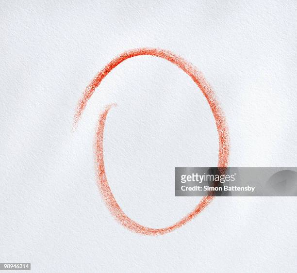 red circle on textured paper, close up - simon o stock pictures, royalty-free photos & images