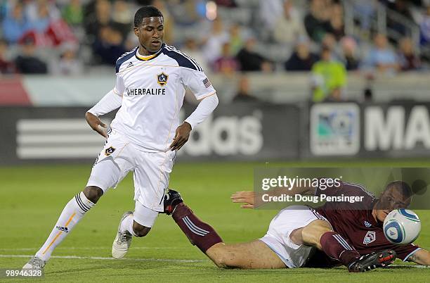 Julien Baudet of the Colorado Rapids steals the ball from Edson Buddle of the Los Angeles Galaxy at Dick's Sporting Goods Park on May 5, 2010 in...