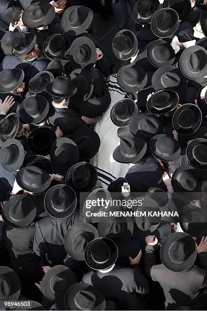 Ultra Orthodox Jews carry the body of former Kneset member Rabbi Menachem Porush during his funeral in Jerusalem on February 22, 2010. Rabbi Menachem...