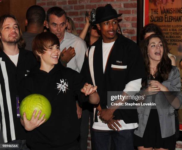 Singer Justin Bieber and actor/TV personality Nick Cannon attend 92.3 NOW's "Bowling with Bieber" record release party at Lucky Strike Lanes & Lounge...