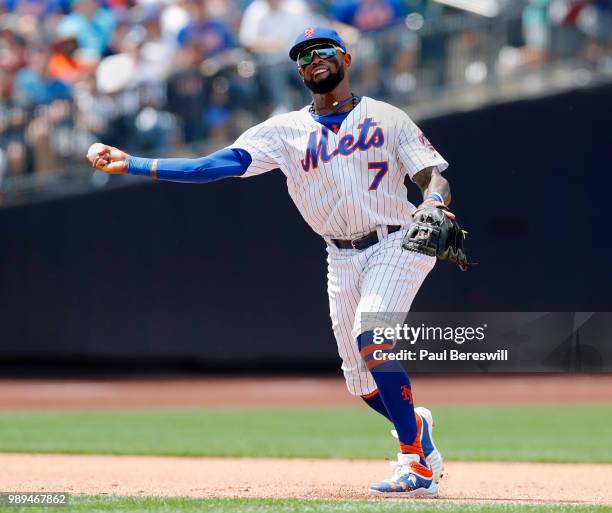 Jose Reyes of the New York Mets throws to first base after fielding a grounder in an MLB baseball game against the Los Angeles Dodgers on June 24,...