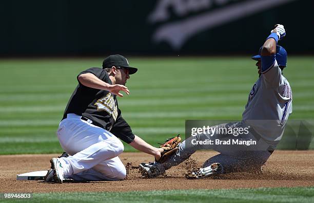 Cliff Pennington of the Oakland Athletics tags out Texas Rangers base runner Elvis Andrus at second base during the game between the Texas Rangers...