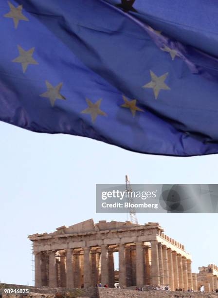 European Union flag flies at the foot of Acropolis hill in Athens, Greece, on Monday, May 10, 2010. European policy makers unveiled an unprecedented...