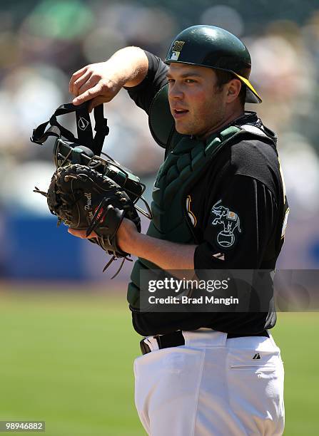 Landon Powell of the Oakland Athletics works the game behind the plate during the game between the Texas Rangers and the Oakland Athletics on...