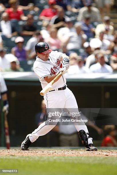 Mike Redmond of the Cleveland Indians hits a run scoring single during the game between the Toronto Blue Jays and the Cleveland Indians on Wednesday,...