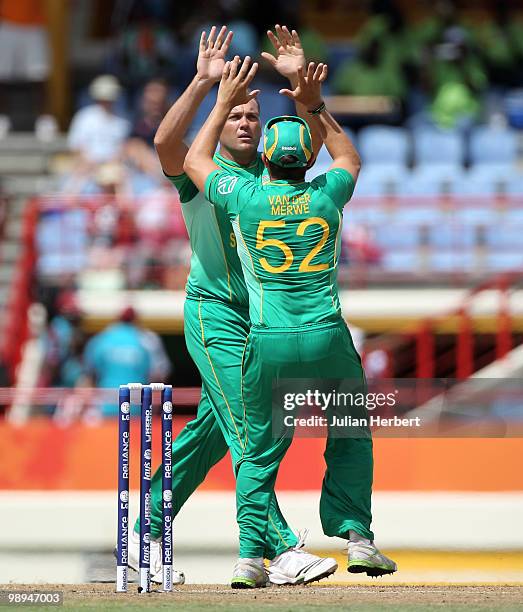 Roelof van der Merwe of South Africa congratulates Jacques Kallis after the dismissal of Khalid Latif during the ICC World Twenty20 Super Eight match...