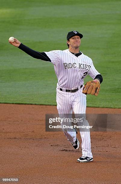 Shortstop Troy Tulowitzki of the Colorado Rockies throws out a runner against the New York Mets during Major League Baseball action at Coors Field on...