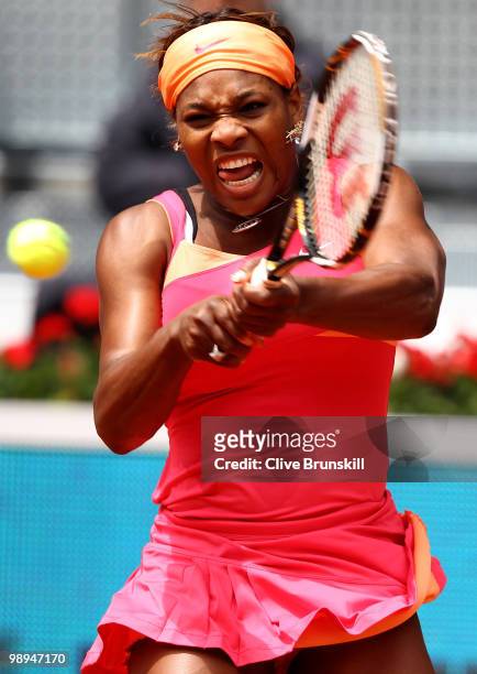 Serena Williams of the USA plays a backhand against Vera Dushevina of Russia in their second round match during the Mutua Madrilena Madrid Open...