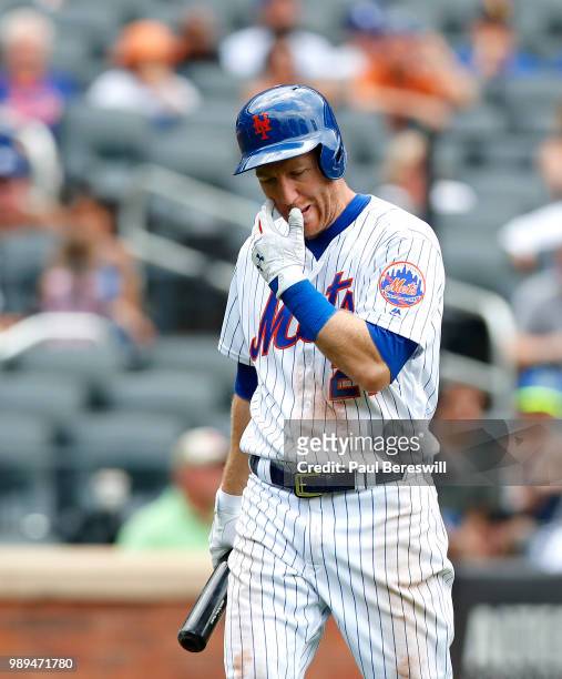 Todd Frazier of the New York Mets walks back to the dugout after striking out in an MLB baseball game against the Los Angeles Dodgers on June 24,...