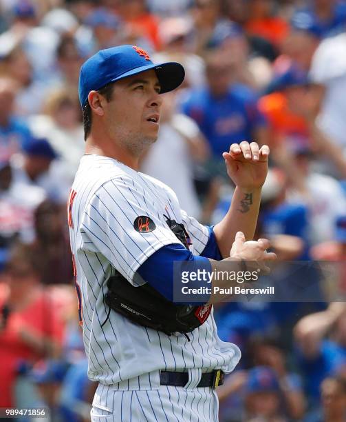 Pitcher Anthony Swarzak of the New York Mets reacts after giving up a home run to Joc Pederson in the 7th inning in an MLB baseball game against the...