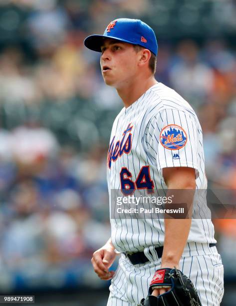 Pitcher Chris Flexen of the New York Mets walks off the field after the last out of the the 11th inning as he gave up the go ahead home run that won...