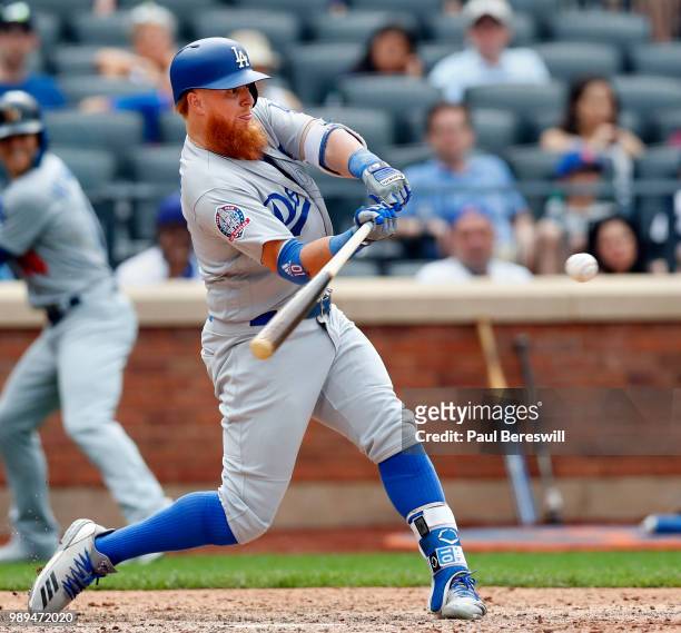 Justin Turner of the Los Angeles Dodgers hits the go ahead home run in the 11th inning in an MLB baseball game against the Los Angeles Dodgers on...