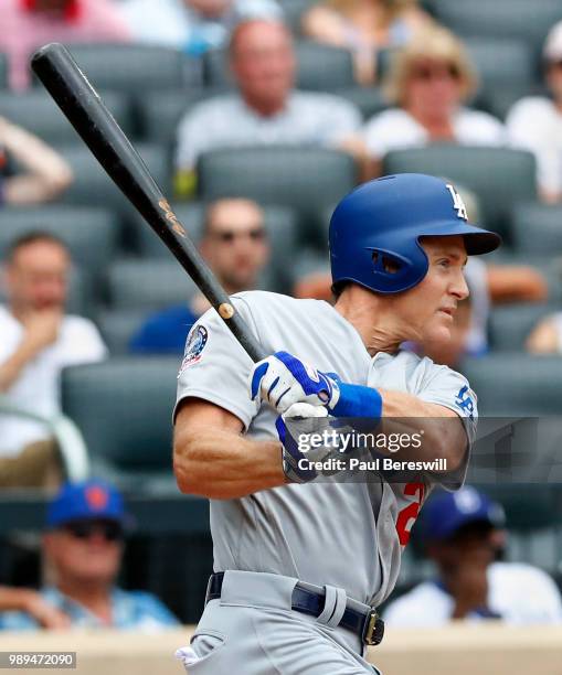 Chase Utley of the Los Angeles Dodgers hits a single in the tenth inning in an MLB baseball game against the Los Angeles Dodgers on June 24, 2018 at...