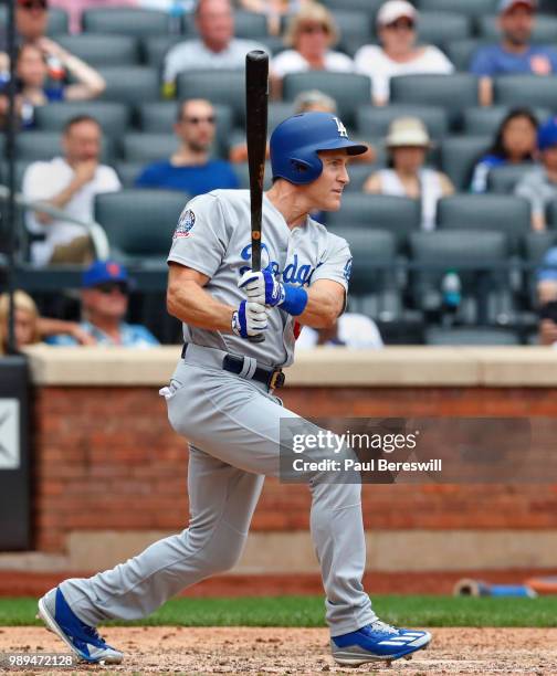 Chase Utley of the Los Angeles Dodgers hits a single in the tenth inning in an MLB baseball game against the Los Angeles Dodgers on June 24, 2018 at...