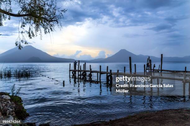 sunset in atitlan - panajachel stock pictures, royalty-free photos & images