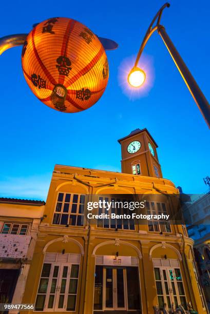 phuket, thailand -june 30, 2018 : old building sino-portuguese style landmark of phuket in night time - inside clock tower stock pictures, royalty-free photos & images