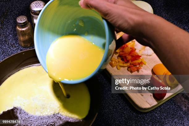 making an omelette - cooking breakfast stock pictures, royalty-free photos & images