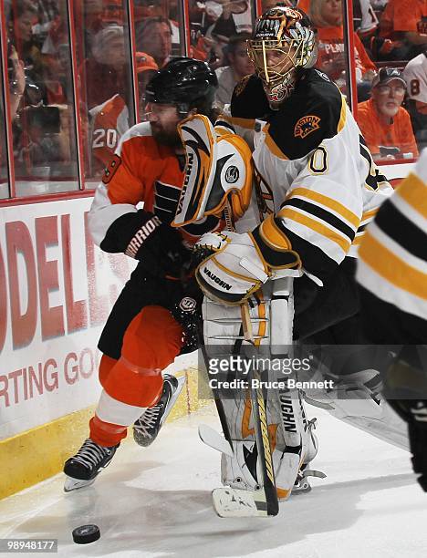 Scott Hartnell of the Philadelphia Flyers collides with Tuukka Rask of the Boston Bruins in Game Four of the Eastern Conference Semifinals during the...