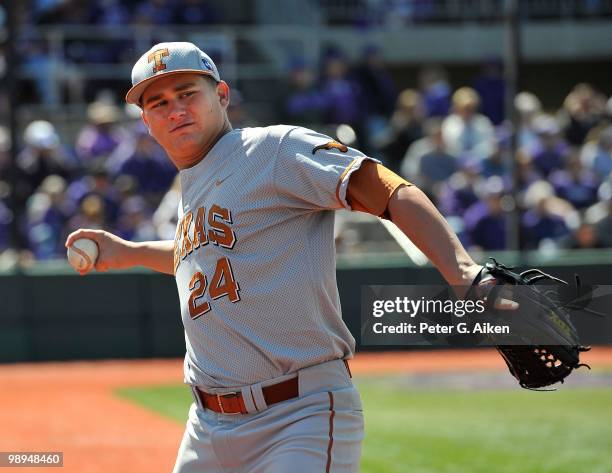 Starting pitcher Cole Green of the Texas Longhorns warms up between innings during a game against the Kansas State Wildcats at Tointon Stadium on May...