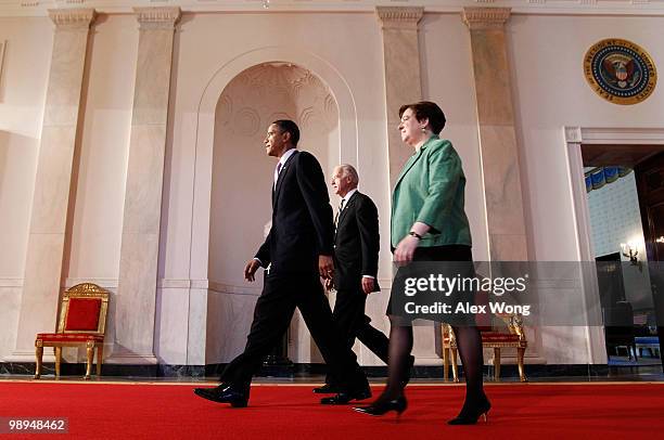 President Barack Obama is joined by Vice President Joe Biden and Solicitor General Elena Kagan as they walk toward the East Room to announce his...