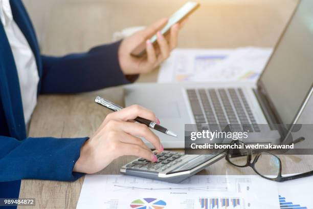 business woman thinking account - accounting calculator stock pictures, royalty-free photos & images