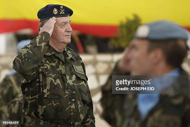 Spain's King Juan Carlos , in full military uniform, salutes Spanish troops serving with the United Nations Interim Force in Lebanon during a visit...