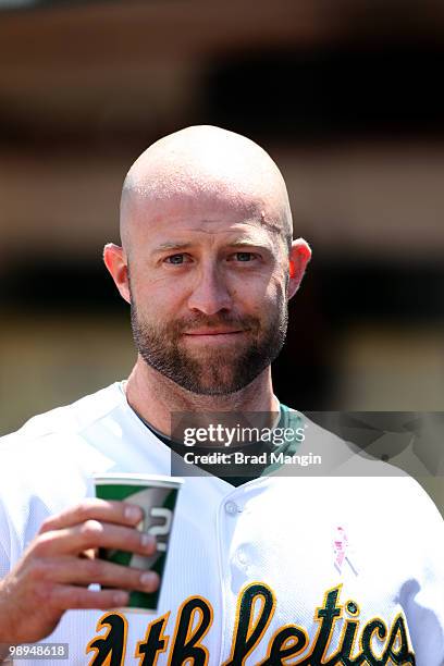 Kevin Kouzmanoff of the Oakland Athletics stands in the dugout during the game between the Tampa Bay Rays and the Oakland Athletics on Sunday, May 9...