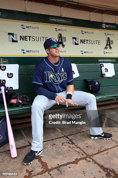 Evan Longoria of the Tampa Bay Rays gets ready in the dugout before the game between the Tampa Bay Rays and the Oakland Athletics on Sunday, May 9 at...