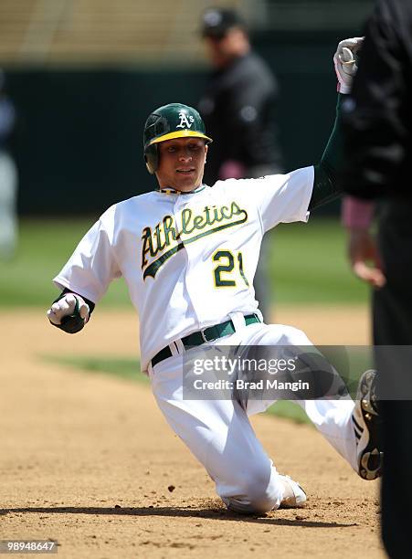 Ryan Sweeney of the Oakland Athletics slides into third base during the game between the Tampa Bay Rays and the Oakland Athletics on Sunday, May 9 at...