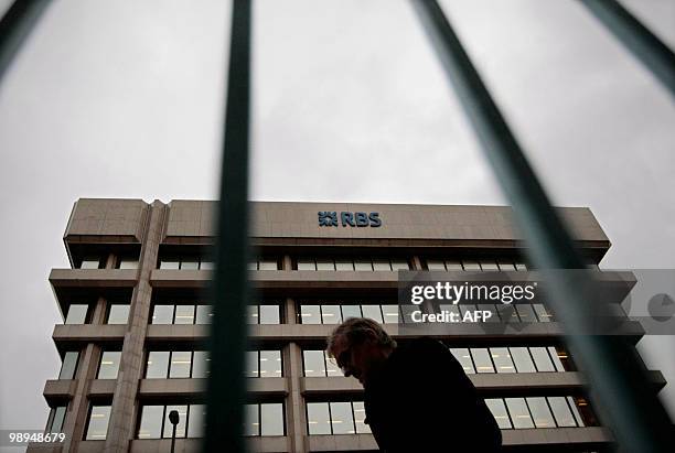 Man walks past Royal Bank of Scotland offices in London, on December 3, 2009. Britain's state-rescued lender RBS announced on Monday May 10, 2010...