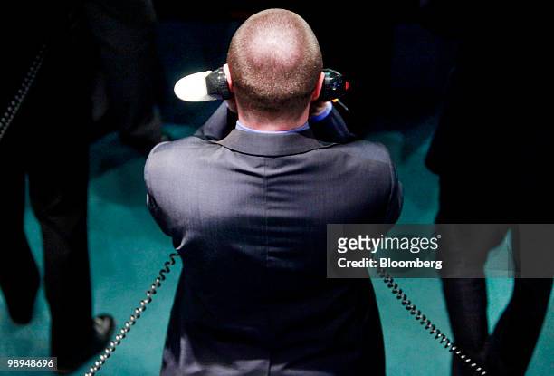 Trader speaks on the telephone while on the floor of the London Metal Exchange in London, U.K., on Monday, May 10, 2010. The euro rallied and stocks...