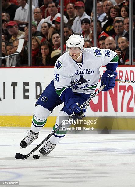 Jannik Hansen of the Vancouver Canucks takes the puck across the ice at Game Two of the Western Conference Semifinals against the Chicago Blackhawks...