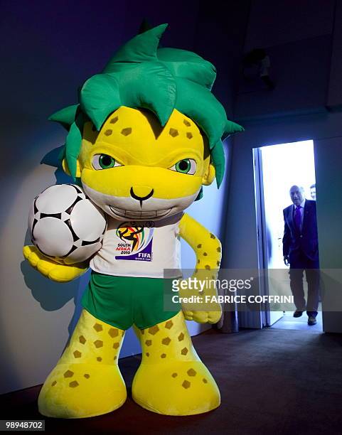 President Sepp Blatter enters behind Zakumi, the FIFA 2010 World Cup mascot, prior to a press conference on April 23, 2010 at the World's governing...