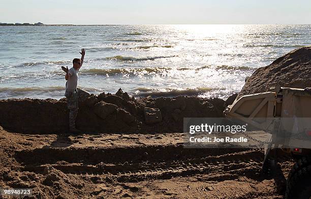 Louisiana National Guard work on creating an earthen barrier to protect an estuary from the massive oil spill on May 10, 2010 in Lafourche Parish,...