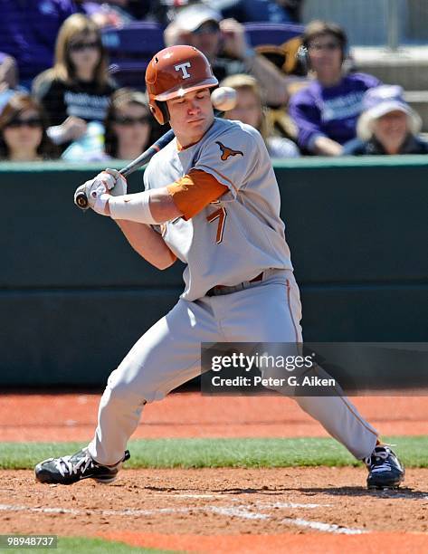 Second baseman Jordan Etier of the Texas Longhorns gets brushed back by a high inside pitch during a game against the Kansas State Wildcats at...