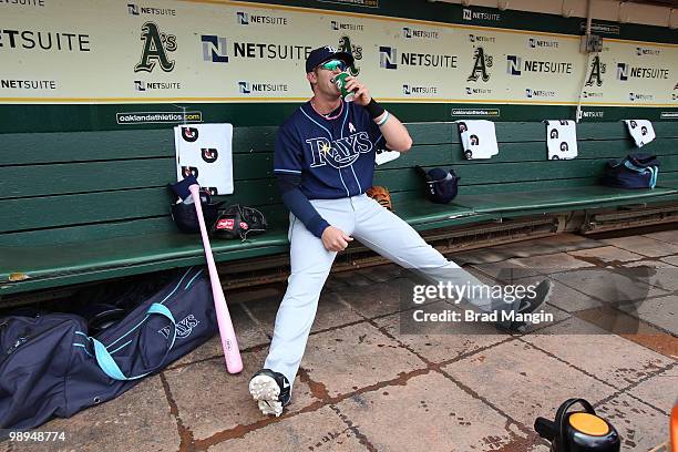 Evan Longoria of the Tampa Bay Rays gets ready in the dugout before the game between the Tampa Bay Rays and the Oakland Athletics on Sunday, May 9 at...