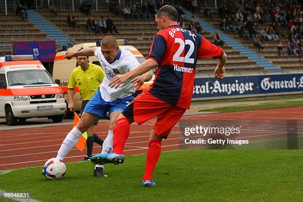 Velimir Grgic of Saarbruecken fights for the ball with Jan-Philipp Hammes of Bonn during the Regionalliga match between Bonner SC and 1.FC...