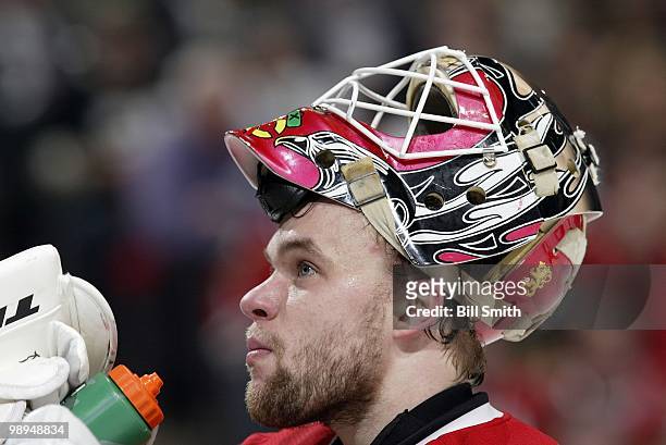 Goalie Antti Niemi of the Chicago Blackhawks cools down in between play against the Vancouver Canucks at Game Two of the Western Conference...