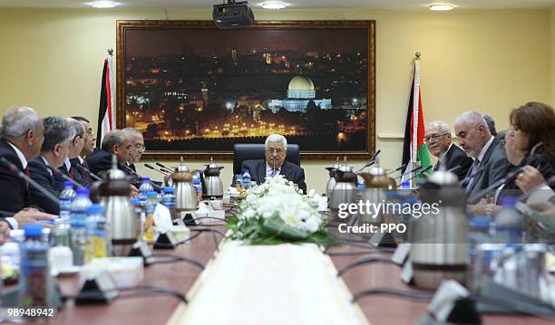 In this handout image supplied by the Palestinian Press Office , Palestinian President Mahmoud Abbas attends a cabinet meeting on May 10, 2010 in...