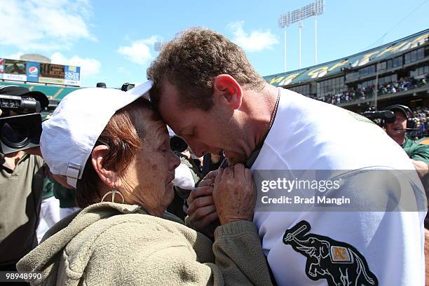 Dallas Braden of the Oakland Athletics celebrates his perfect game with his grandmother Peggy Lindsey after the game between the Tampa Bay Rays and...