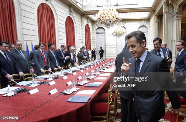 French president Nicolas Sarkozy , followed by Prime minister Francois Fillon arrive for a meeting with trade unions and employers' unions...