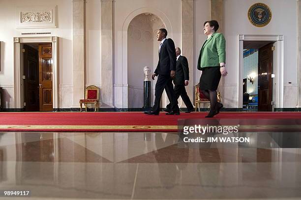Solicitor General Elena Kagan walks with Vice President Joe Biden and US President Barack Obama to the East Room to nominated her to the Supreme...