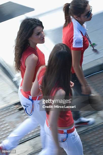 Three grid girls walk in paddock during the second day of test at Circuito de Jerez on May 1, 2010 in Jerez de la Frontera, Spain.