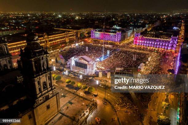 Supporters of the presidential candidate for the "Juntos haremos historia" coalition, Andres Manuel Lopez Obrador, celebrate at the Zocalo square in...