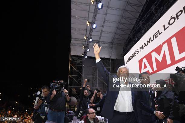 Newly elected Mexico's President Andres Manuel Lopez Obrador , running for "Juntos haremos historia" party, cheers his supporters at the Zocalo...