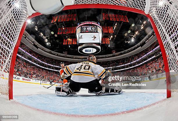 Claude Giroux of the Philadelphia Flyers shoots the puck wide of goaltender Tuukka Rask of the Boston Bruins with 17:10 remaining in the first period...